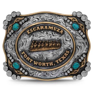 A custom belt buckle for women featuring an escaramuza golden figure and lettering for Fort Worth, Texas, adorned with turquoise stones 